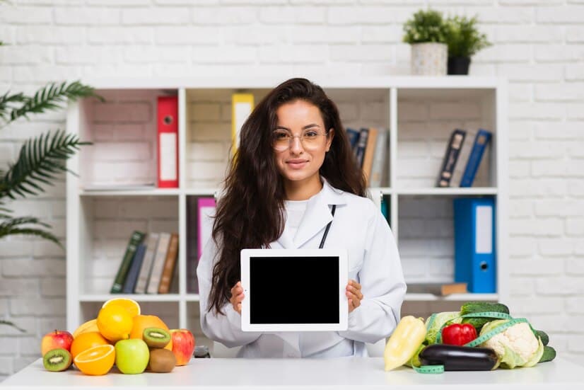 Young Doctor Holding Tablet